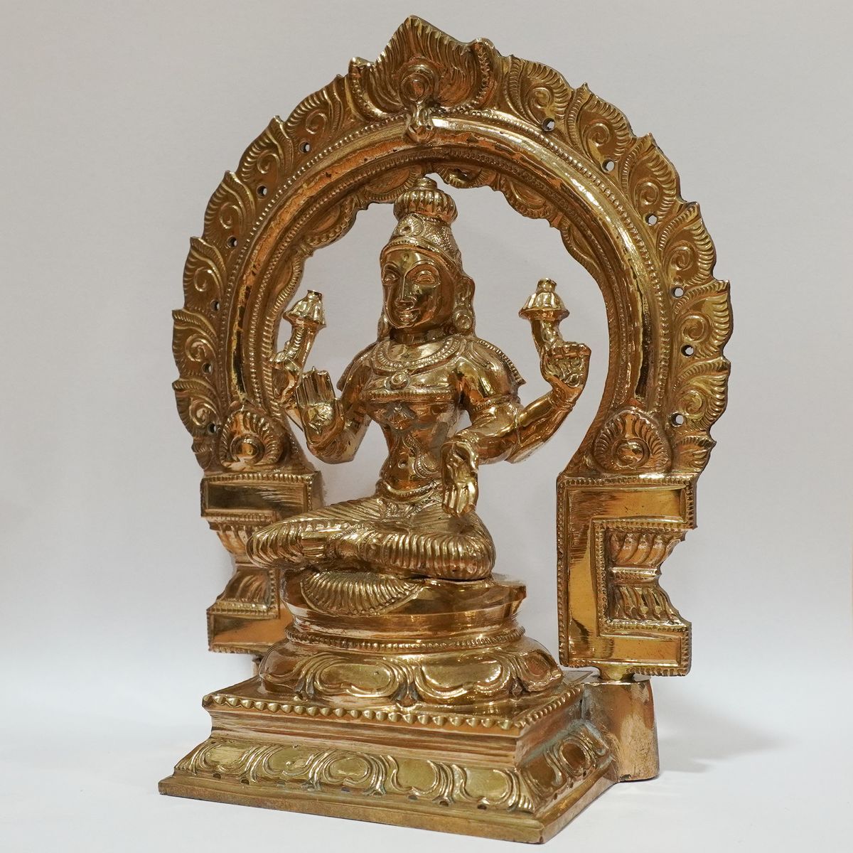BRONZE LAKSHMI IDOL WITH PRABHAVALI